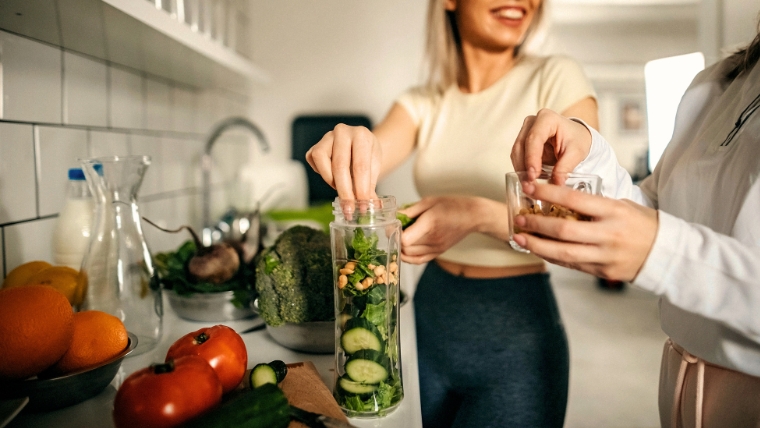 Two people preparing a healthy meal | Eat Your Way to Happiness The Link Between Healthy Eating and Mental Health | Mindful Health Solutions