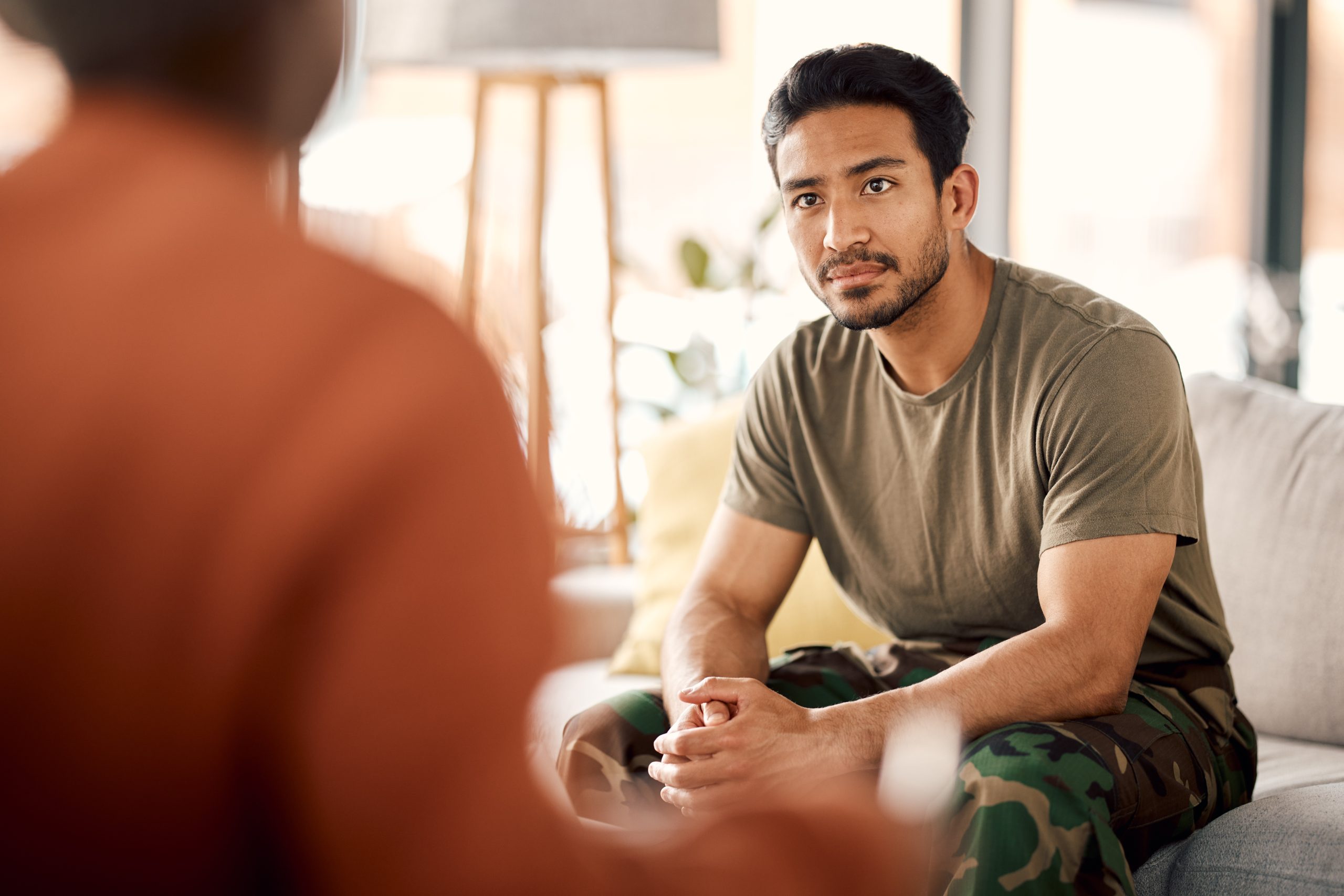 A person standing outside looking up and out toward the horizon with a hopeful expression | Accelerated dTMS The Day-to-Day of this Powerful Depression Treatment | Mindful Health Solutions